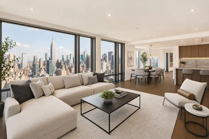 Modern NYC apartment living room with large windows, city views, elegant furnishings, and natural light