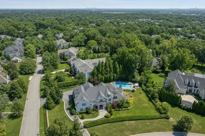 Aerial view of a residential neighborhood in New Jersey captured by drone, highlighting homes, streets, and green spaces