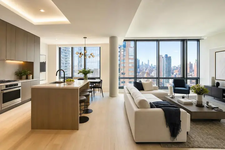 Bright, modern living room with large windows, stylish furnishings, and city views, showcasing Matterport NYC virtual tour quality