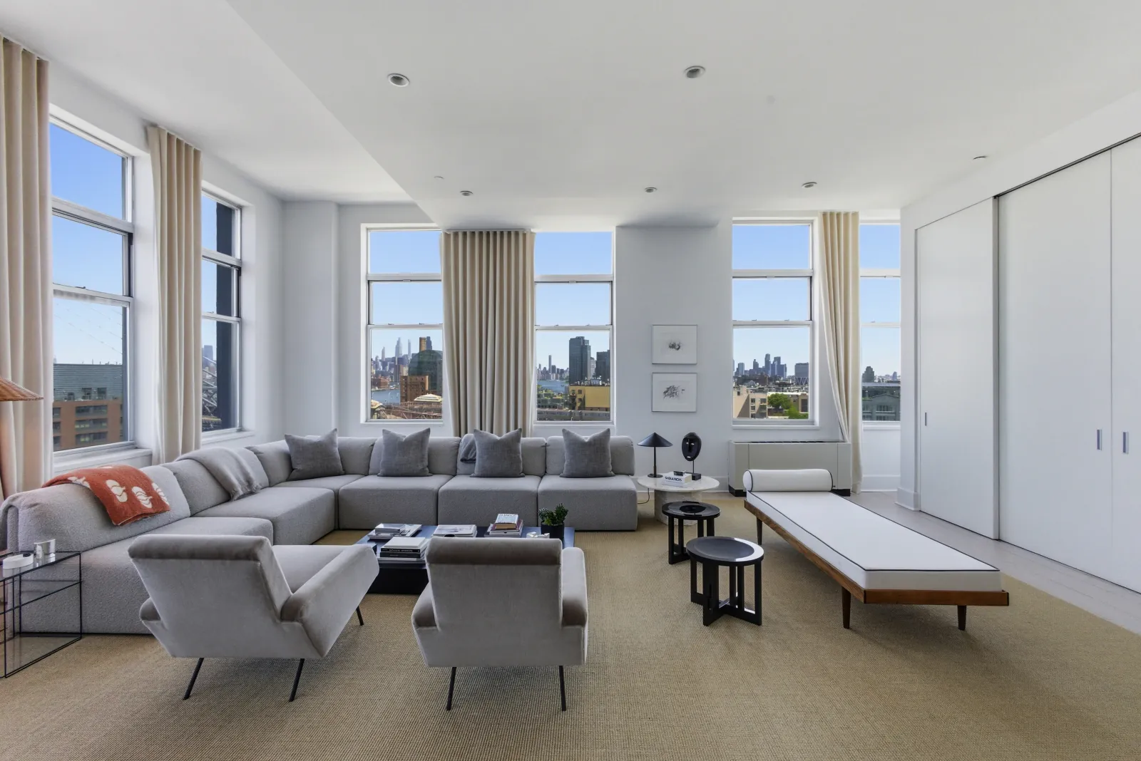 Bright NYC dining and living area by RealtaSnap