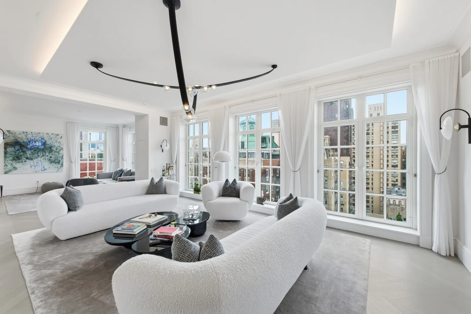 Bright NYC dining and living area by RealtaSnap